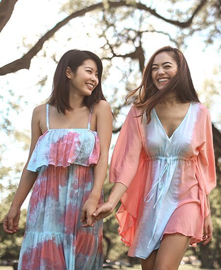 two girls wearing flowy blue and pink clothes from Angels by the Sea Hawaii