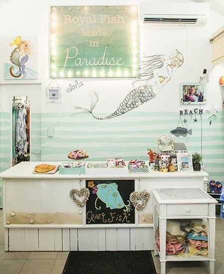 interior photo of Royal Fish showing a mermaid painted on the wall