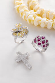 two white gold rings and one white gold cross pendant