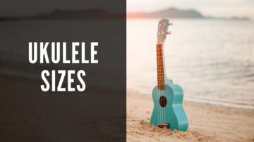 ukulele sizes, photo of a blue ukulele in the sand on the beach